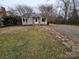 Gray house with stone accents and a stone path at 13655 Broadway Ave, Midland, NC 28107