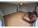 Bright living room featuring laminate flooring and a comfy couch at 13655 Broadway Ave, Midland, NC 28107