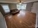 Spacious living room with laminate floors and lots of natural light at 13655 Broadway Ave, Midland, NC 28107