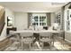 Modern dining room with light-wood table and six beige chairs at 1414 Pine Heart Dr, Edgemoor, SC 29712