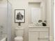 Clean bathroom with white vanity, bathtub, and toilet at 1418 Pine Heart Dr, Edgemoor, SC 29712