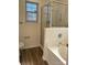 Clean bathroom featuring a bathtub and shower at 1638 Hudson Graham Ln, Charlotte, NC 28216