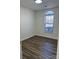 Bedroom with hardwood floors and an arched window at 1638 Hudson Graham Ln, Charlotte, NC 28216