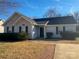 House exterior featuring gray siding and landscaping at 1638 Hudson Graham Ln, Charlotte, NC 28216