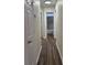 Clean hallway with light walls and wood-look flooring at 1638 Hudson Graham Ln, Charlotte, NC 28216