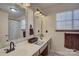 Elegant bathroom with double sinks, framed mirrors, and stylish fixtures, blending functionality and design at 1687 Riverdale Dr, Rock Hill, SC 29732