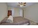 Neutral bedroom featuring two closets, carpet, and a ceiling fan for comfortable living at 1687 Riverdale Dr, Rock Hill, SC 29732