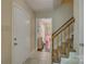 View of entryway with tile floors, stairs, and a view into the playroom at 1687 Riverdale Dr, Rock Hill, SC 29732