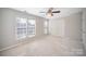 Spacious bedroom with plush carpeting and double door closet at 17629 Delmas Dr, Cornelius, NC 28031