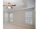 Well-lit bedroom featuring two windows and a ceiling fan at 17629 Delmas Dr, Cornelius, NC 28031