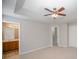 Spacious bedroom with ceiling fan and en-suite bathroom access at 17629 Delmas Dr, Cornelius, NC 28031