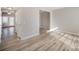 Light-filled hallway with wood-look floors and doors at 17629 Delmas Dr, Cornelius, NC 28031