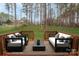 Relaxing deck overlooks a wooded backyard at 203 Bud Black Rd, Crouse, NC 28033