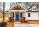 Front porch with blue door and wooden railings at 203 Bud Black Rd, Crouse, NC 28033