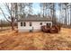 Back of house with deck and wooded view at 203 Bud Black Rd, Crouse, NC 28033