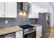 Stainless steel appliances and granite countertops in this modern kitchen at 203 Bud Black Rd, Crouse, NC 28033