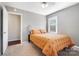 Well-lit bedroom with neutral decor, a comfortable bed, and an adjacent closet at 2203 O'Hara Dr, Charlotte, NC 28273