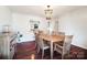 Dining room with hardwood floors, wooden table, and view into kitchen at 2203 O'Hara Dr, Charlotte, NC 28273