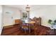 Bright dining room featuring hardwood floors and an oval wooden table at 2203 O'Hara Dr, Charlotte, NC 28273