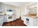 Modern kitchen featuring light gray cabinets, granite countertops, and wood floors at 2203 O'Hara Dr, Charlotte, NC 28273