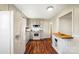 Renovated kitchen with white appliances and light wood flooring at 2203 O'Hara Dr, Charlotte, NC 28273