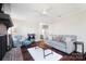 Bright living room featuring hardwood floors, a cozy fireplace, and ample natural light at 2203 O'Hara Dr, Charlotte, NC 28273