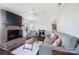 Living room featuring hardwood floors, brick fireplace, and a ceiling fan at 2203 O'Hara Dr, Charlotte, NC 28273