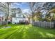 Sunny backyard with artificial turf and a large deck at 2358 Morton St, Charlotte, NC 28208