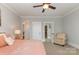 Spacious bedroom with plush bedding and an adjacent sitting area at 2358 Morton St, Charlotte, NC 28208