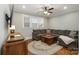 Comfortable bonus room with sectional sofa and hardwood floors at 2358 Morton St, Charlotte, NC 28208