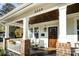 Inviting front porch with brick columns and wood ceiling at 2358 Morton St, Charlotte, NC 28208