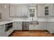 Modern kitchen with stainless steel appliances and a farmhouse sink at 2358 Morton St, Charlotte, NC 28208