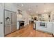 Open concept kitchen with stainless steel appliances and hardwood floors at 2358 Morton St, Charlotte, NC 28208