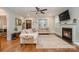 Light-filled living area featuring a fireplace and hardwood floors at 2358 Morton St, Charlotte, NC 28208