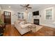 Living room with hardwood floors, fireplace, and large windows at 2358 Morton St, Charlotte, NC 28208