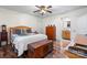 Bedroom with wood flooring, ceiling fan, and ensuite bathroom at 241 Pinecrest Ct, Taylorsville, NC 28681