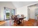 Bright dining room with wood floors and access to backyard at 241 Pinecrest Ct, Taylorsville, NC 28681