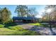 Inviting brown wood siding home with a covered porch and charming landscaping at 241 Pinecrest Ct, Taylorsville, NC 28681