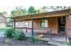 Covered porch with pumpkin decor and wooden railing at 241 Pinecrest Ct, Taylorsville, NC 28681