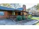 Covered porch with wood railings and lush green bushes at 241 Pinecrest Ct, Taylorsville, NC 28681