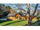 Back of house, wood siding, green trim, fire pit at 241 Pinecrest Ct, Taylorsville, NC 28681