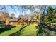 Back of house, wood siding, green trim, fire pit at 241 Pinecrest Ct, Taylorsville, NC 28681