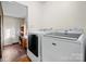 Laundry room with a washer and dryer and additional storage at 241 Pinecrest Ct, Taylorsville, NC 28681