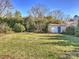 Large backyard with storage shed and lush lawn at 2625 Croydon Rd, Charlotte, NC 28209