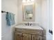 Updated bathroom with a single vanity and shower/tub combo at 2625 Croydon Rd, Charlotte, NC 28209