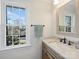 Bathroom with vanity, sink, large mirror, and a towel rack at 2625 Croydon Rd, Charlotte, NC 28209