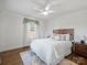 Bright bedroom featuring hardwood floors and a ceiling fan at 2625 Croydon Rd, Charlotte, NC 28209