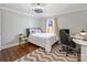 Cozy bedroom with a desk and plenty of natural light at 2625 Croydon Rd, Charlotte, NC 28209