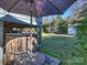 Wooden hot tub on patio, offering a tranquil outdoor experience at 2625 Croydon Rd, Charlotte, NC 28209