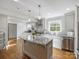 Spacious kitchen featuring granite countertops, stainless steel appliances, and white cabinetry at 2625 Croydon Rd, Charlotte, NC 28209